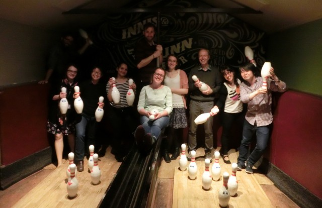 Lab group in a bowling alley with skittles.